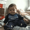 baby laughing and falling over gif